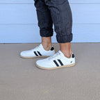 RYVYN ARC minimalist footwear in Off White Black worn side view