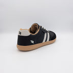 RYVYN INK minimalist footwear in Black Off White heel angled view