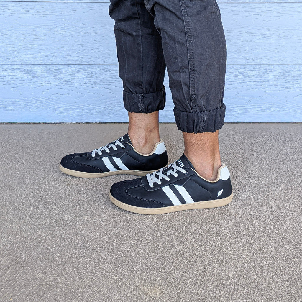 RYVYN INK minimalist footwear in Black Off White worn side view