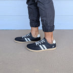 RYVYN INK minimalist footwear in Black Off White worn side view